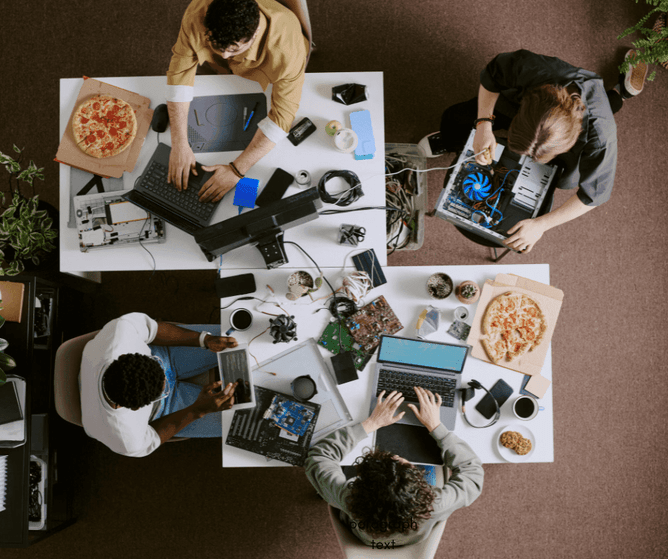 A group of digital nomads working at a shared tech space in Cambridge