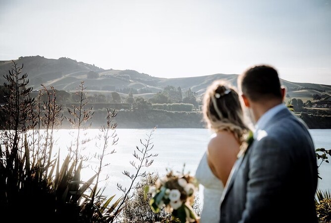 Couple at the Boatshed overlooking Karapiro Lake
