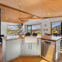 Kitchen with heirloom timber totara benchtop.