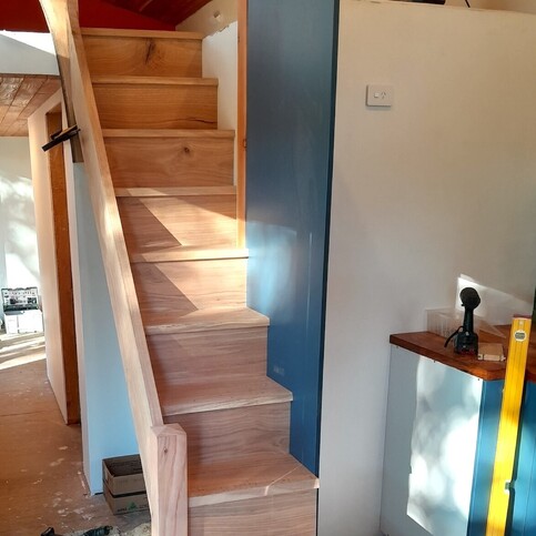 Solid oak staircase for a tiny home made by Harwood Joinery.