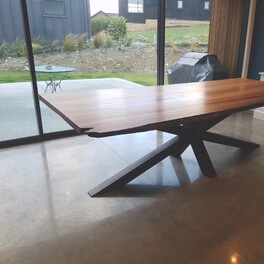 Hand built table top with designer steel base.