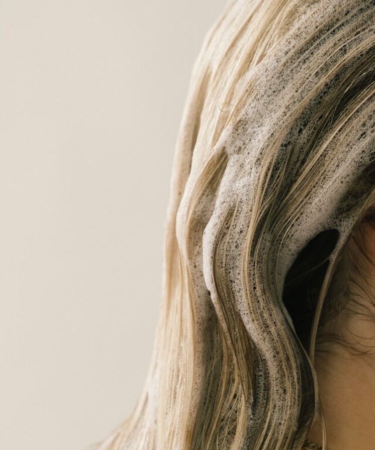 Hair with shampoo bubbles in it.