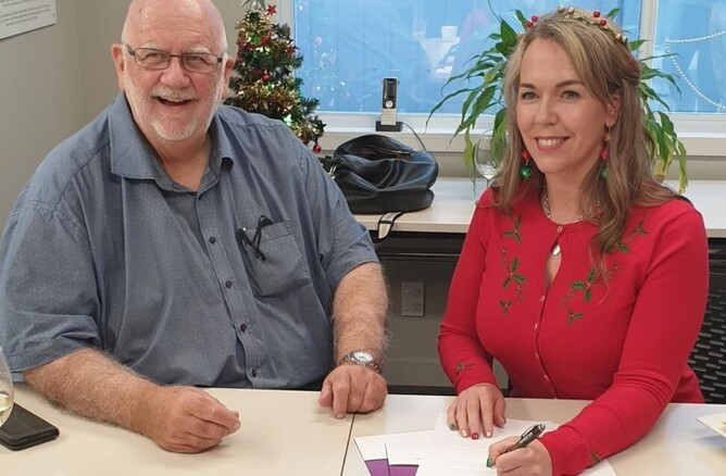 Ken Williamson and Maree Haddon sign the agreement with Momentum.
