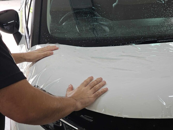 Business vehicle getting PPF applied to maintain a clean and professional look