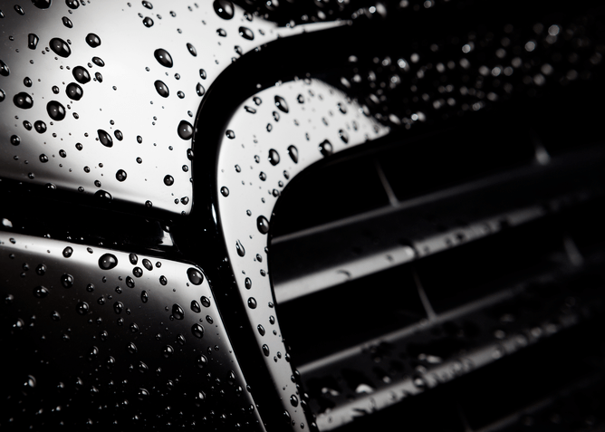 Close-up of water beading on vehicle after ceramic coating application in Hamilton
