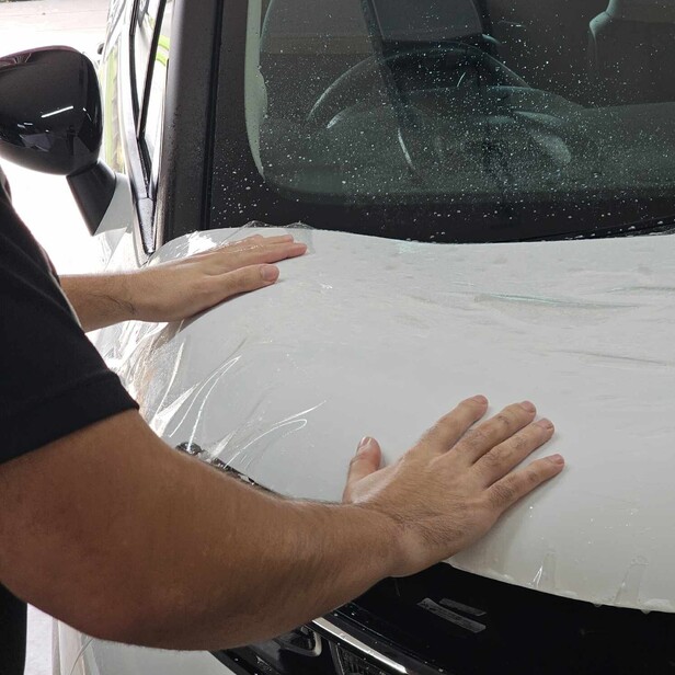 paint protection film being applied to protect your vehicle against minor scratches and abrasions while preserving your paint's original finish