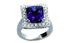 Cushion cut Tanzanite ring approximately 6.5ct with round brilliant diamonds set in Platinum