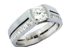 Cushion cut centre stone, split shank set in Platinum