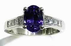 Ceylonese sapphire with princess cut diamonds set in Platinum