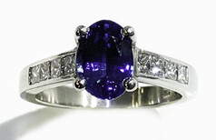 Ceylonese Sapphire with princess cut diamonds set in Platinum