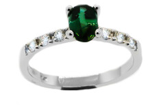 Oval Tourmaline with round brilliant diamonds set in Platinum
