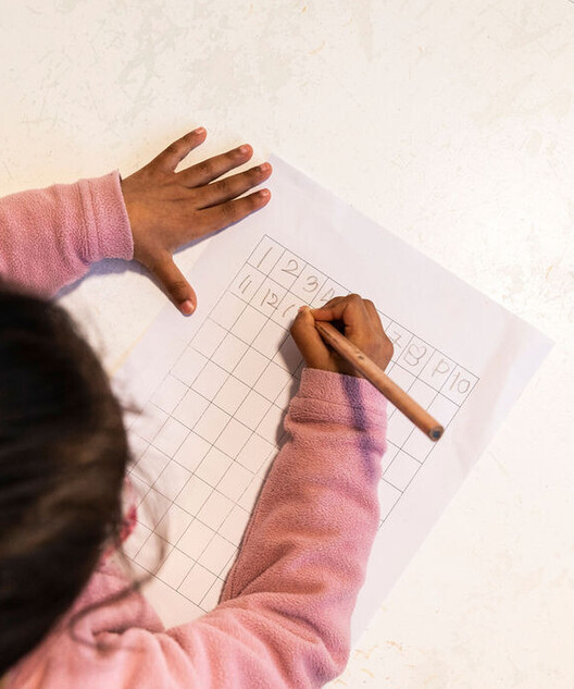 Child choosing work in a prepared Montessori environment