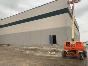 Homegoods Warehouse Addition - Metal framed exterior walls and dense glass installation completed to the Homegoods warehouse located in Brownsburg, Indiana