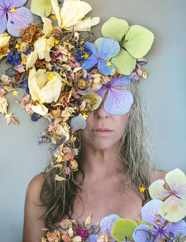 My first ever commission, first we photographed, tricky as it was a secret, then I laid out a selection of fresh and dried flowers, rephotographed it, printed large and finished with gold leaf.