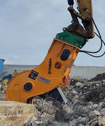 Italian Indeco brand IFP 35x Fixed Pulverizer pulverizing waste concrete in a concrete recycling yard