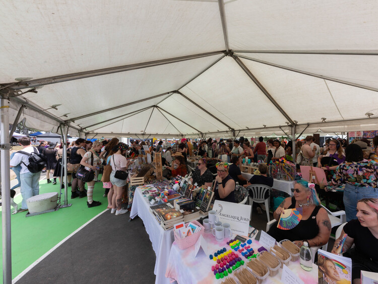 Corporate event marquee with presentation area, full seating, and branded signage – complete business marquee hire Auckland