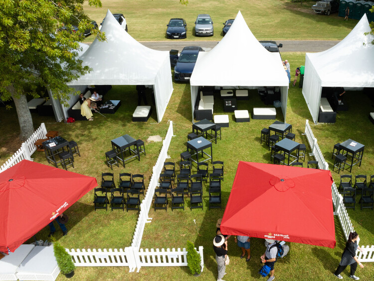VIP marquee lounge at sports event with seating and refreshments – premium event marquee Auckland