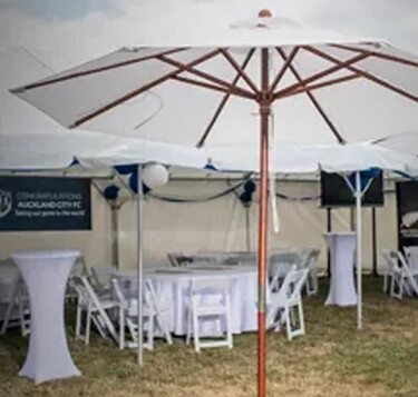 Large white outdoor umbrella for event shade – umbrella hire Auckland for marquee events