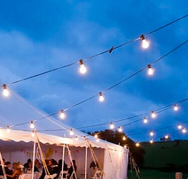 Chandeliers inside wedding marquee – elegant lighting rental Auckland