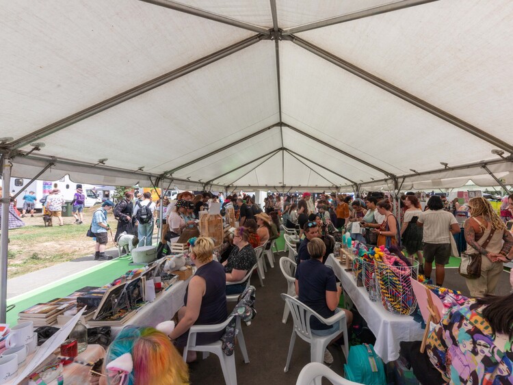 Corporate event marquee with presentation area, full seating, and branded signage – complete business marquee hire Auckland
