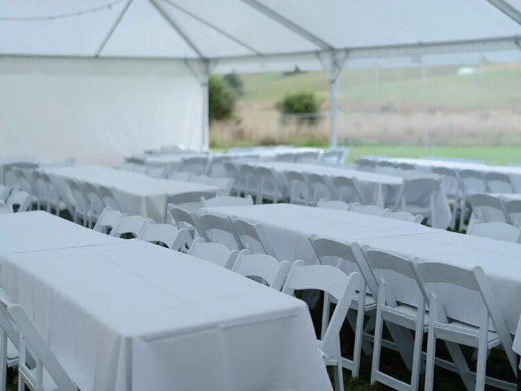 White trestle tables arranged for catering – event table hire Auckland