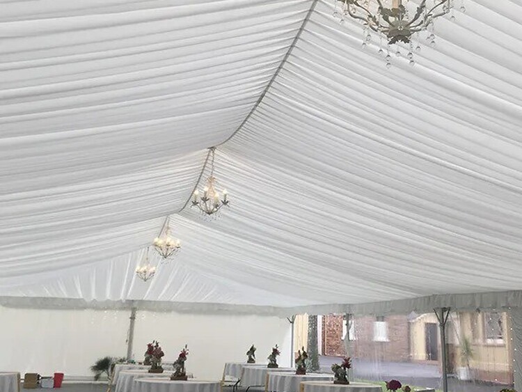 Elegant ceiling draping inside white marquee – ceiling draping hire Auckland