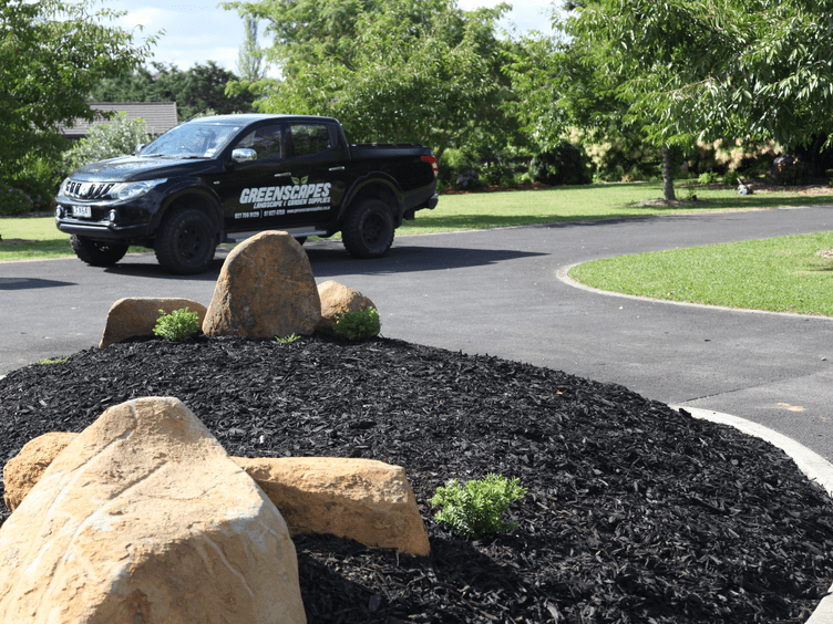 Mulch and feature boulders plus greenscapes ute