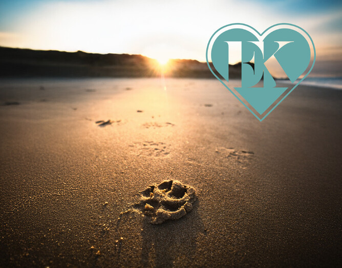 Photo of paw print in the sand on a beach