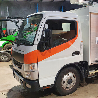 Partial vinyl wrap on work vehicle