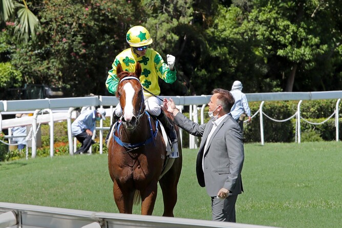 Joao Moreira and Caspar Fownes celebrate after Sky Field's win on Sunday. Photo: HKJC