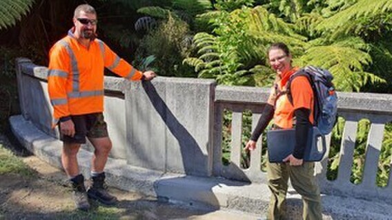 DOC works officer Charlotte Fletcher checks out the finished work with Ricky Archer.