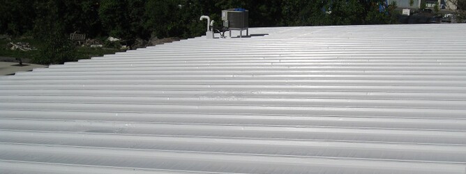 Cool roof spec surface after application of a white roof coating