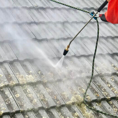 cleaning moss and mould from asbestos building