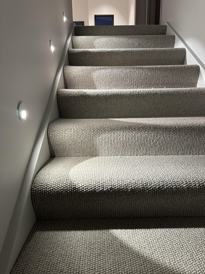 Lighting along steps in hallway of new build home in Maungatapu, Tauranga