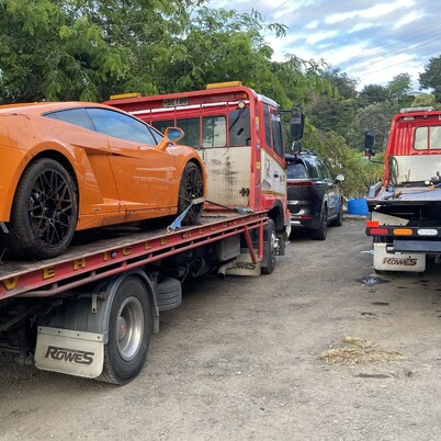 Rowes truck towing car