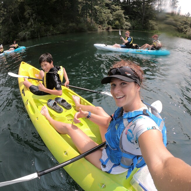 Steaming Kayak Guide Zita with child customer loving it