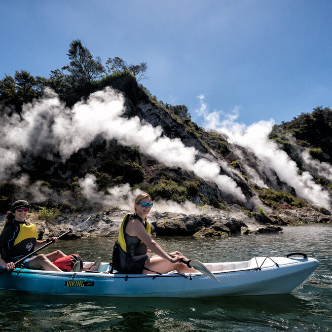 Steaming Cliffs Close Up Kayakers on  Geothermal Fumarol Geyser Tour