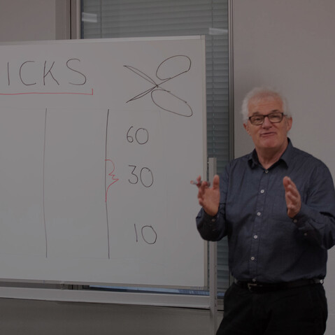 Vaughan Renner, senior consultant at GGA, presenting during a governance workshop with a whiteboard