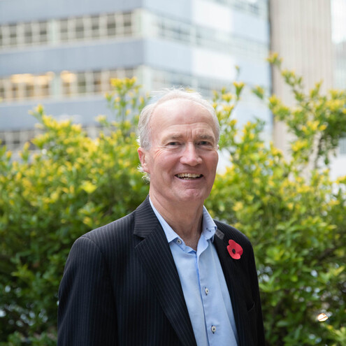 Richard Westlake, Founder and Managing Director of Westlake Governance, part of GGA, standing outdoors in a business suit, highlighting his expertise in governance and board leadership.