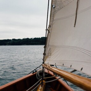 Sailboat symbolising strategic governance development, representing the merger of Westlake Governance and Peakstone Global to form Global Governance Advisory (GGA) for better board performance.
