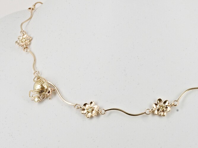 Gold flowers, diamonds and bee, necklace. New Zealand