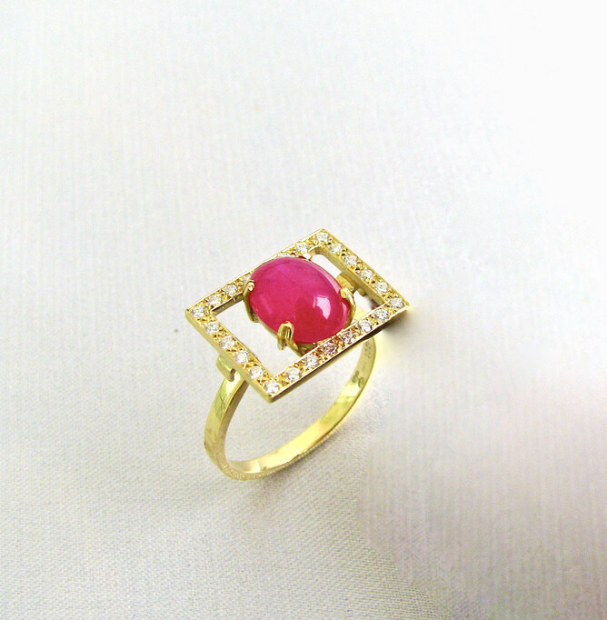 Cabochon ruby surrounded by diamonds. Sold.