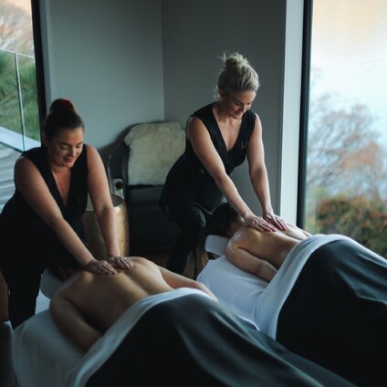 A client receiving a gorgeous head massage during a facial treatment.
