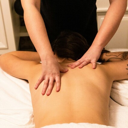 A treatment bed set up in a home with a fire gently burning in the background.