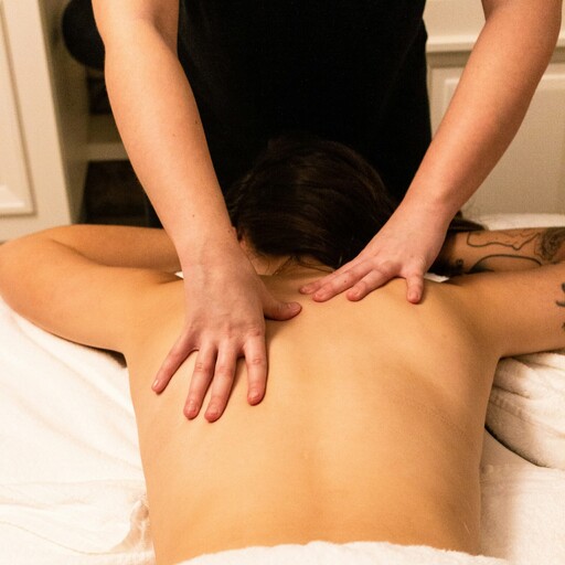 A treatment bed set up in a home with a fire gently burning in the background.