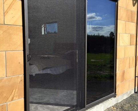 Image of a doorway fitted with a security screen.