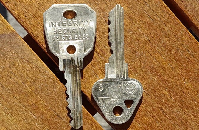 A photo of Integrity Security Restricted keys on  wooden table background