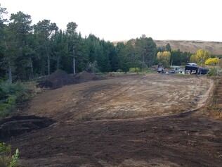 landscaping and earth pile clearing, site drainage