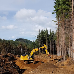 Hawke's Bay Forest Roading, Maintaining a track in a Hastings Forest in Hawke's Bay, metalling a road in Hastings, Shingle onto road in Hastings, Earthmoving in a Hastings Forest