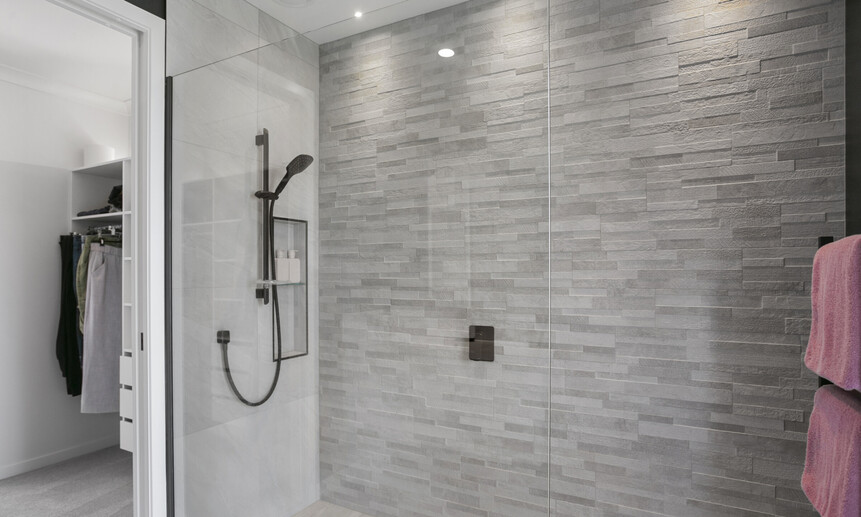The glass shower faux wall, allows for the walk-in shower to fit perfectly in this small but luxurious ensuite bathroom.